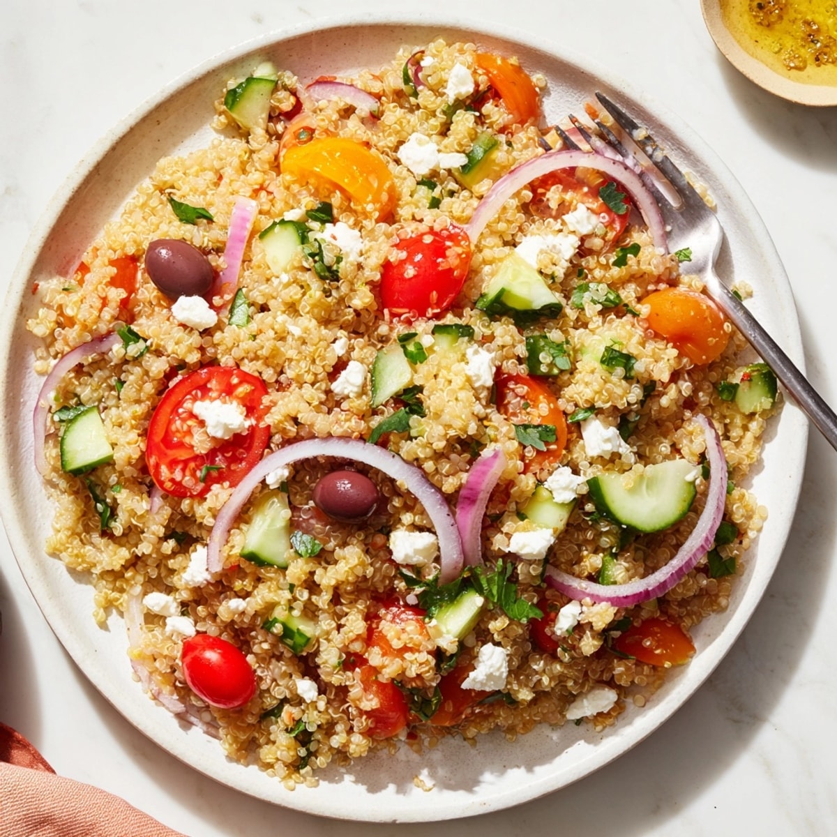 Perfect summer lunch: Mediterranean Quinoa Salad with lemon-oregano dressing, bursting with flavor and textures.