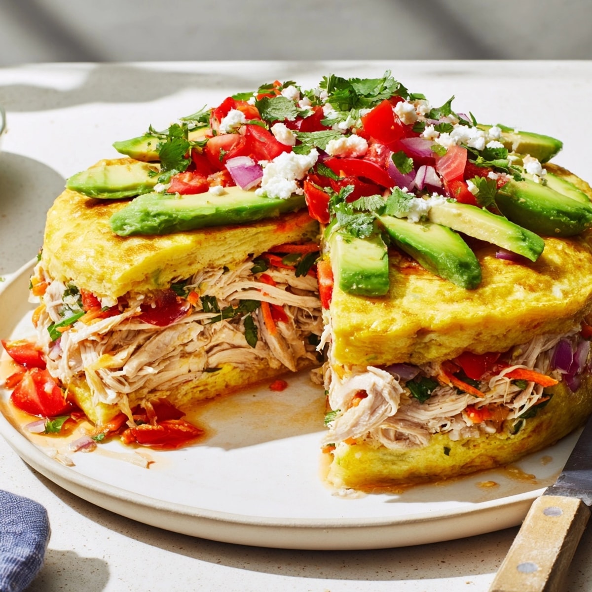 Close-up of a Chicken Avocado Wrap, showcasing fresh ingredients and creamy dressing.