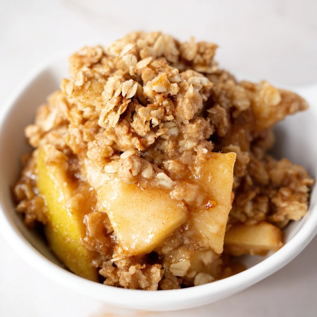 Homemade Cinnamon Apple Crisp with a crunchy oat topping, a nostalgic, comforting dessert.