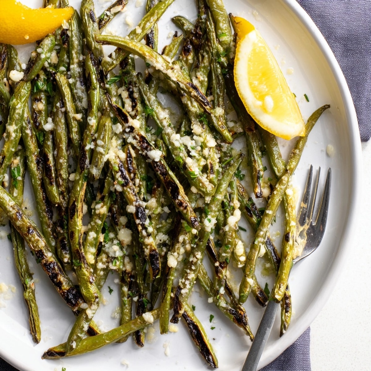 Golden Parmesan Green Beans roasting in the oven, a side dish ready to serve.