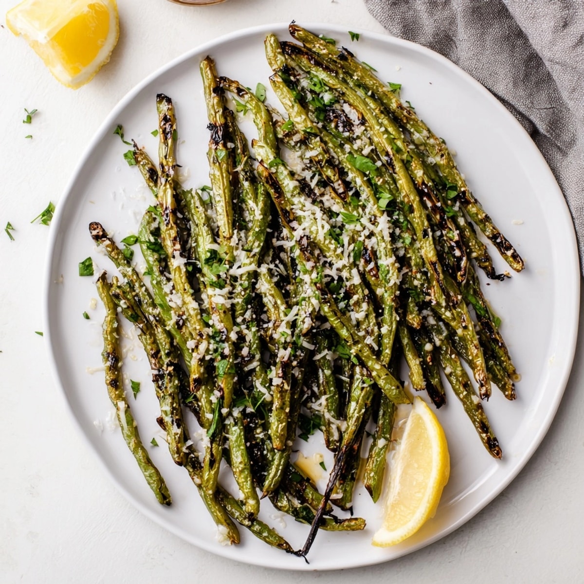 Easy roasted Parmesan Green Beans recipe, perfectly blistered and aromatic, for a quick dinner.