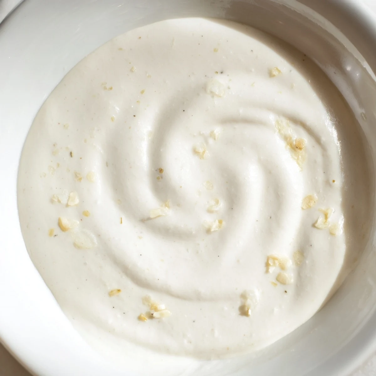 Creamy sauce coats perfectly cooked pasta; rich flavors from garlic, Parmesan, and heavy cream.