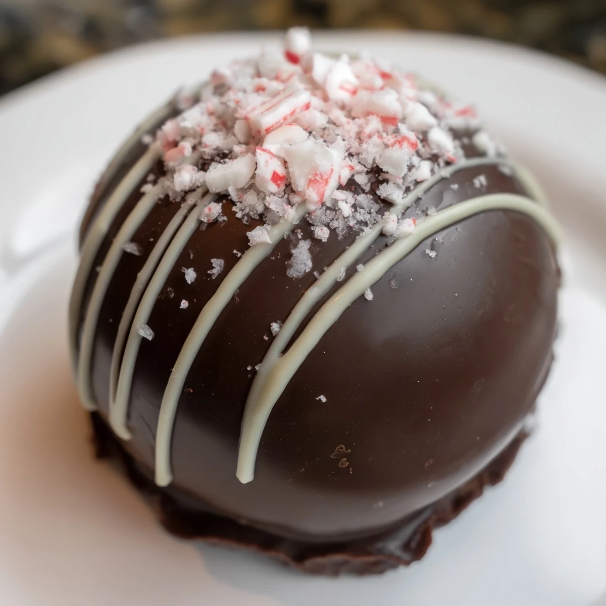 Steaming mug of rich Peppermint Hot Cocoa Bombs, brimming with marshmallows, a festive holiday treat.