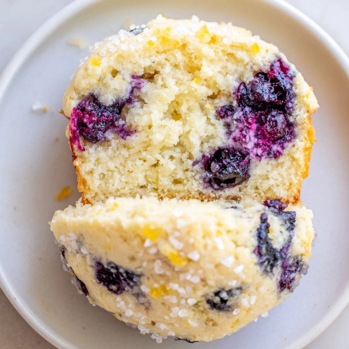 A close-up of delicious Lemon Blueberry Yogurt Muffins, showcasing a delightful crumb and bright lemon flavor.