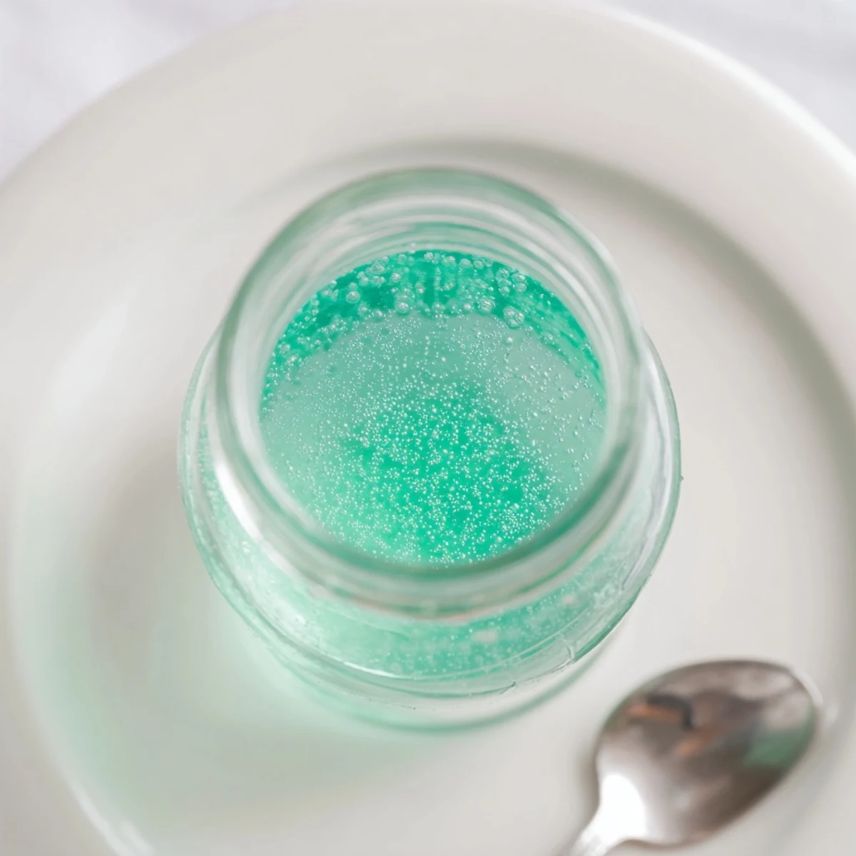 Homemade peppermint flavor syrup, cooling to perfection, ready to infuse coffee and desserts with mint.