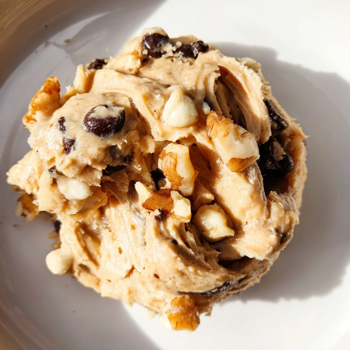 A spoonful of Guilt Free Greek Yogurt Cookie Dough, creamy and studded with dark chocolate chips and walnuts.