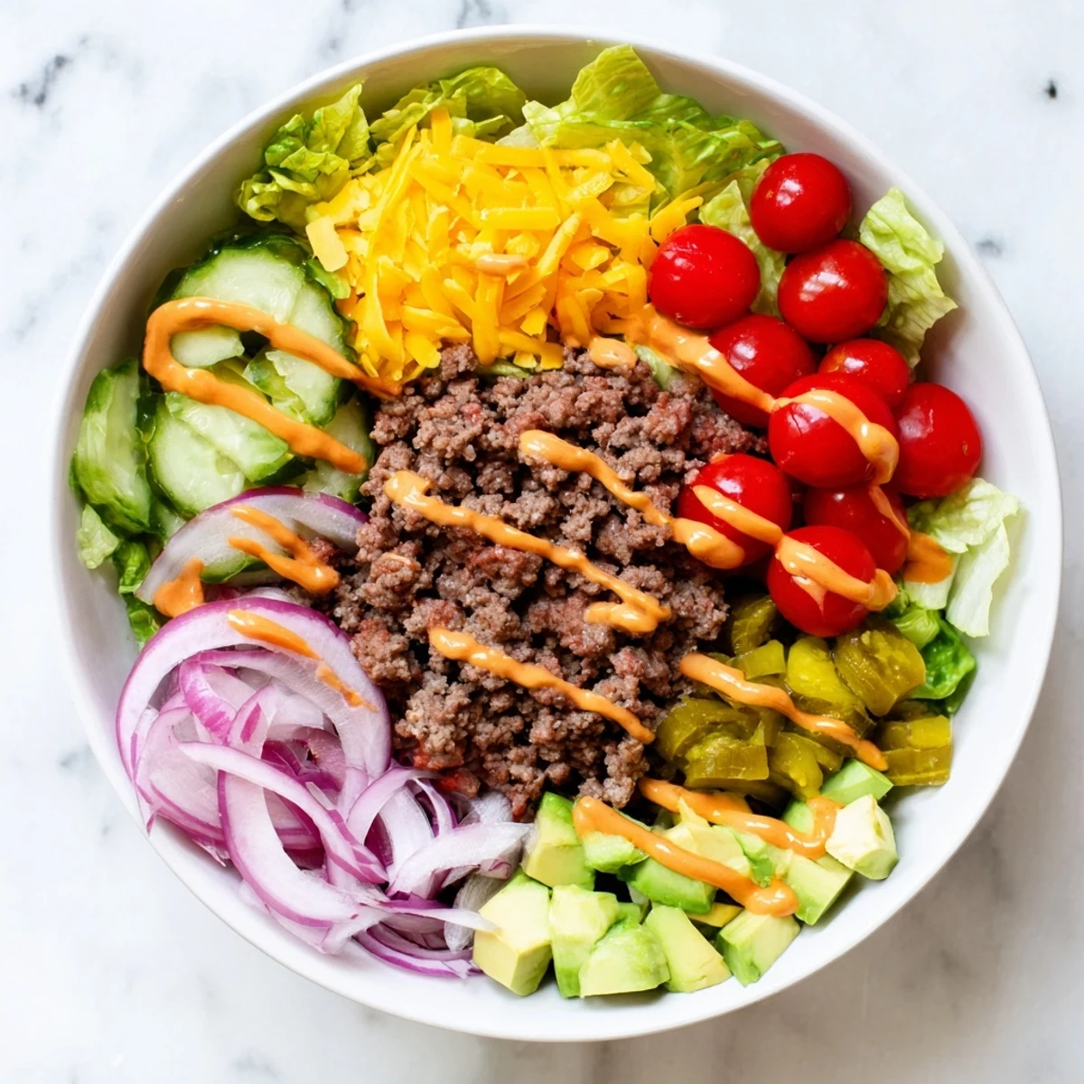 Juicy seasoned ground beef and crisp romaine lettuce in Burger Bowls topped with cherry tomatoes and melted cheddar cheese.  