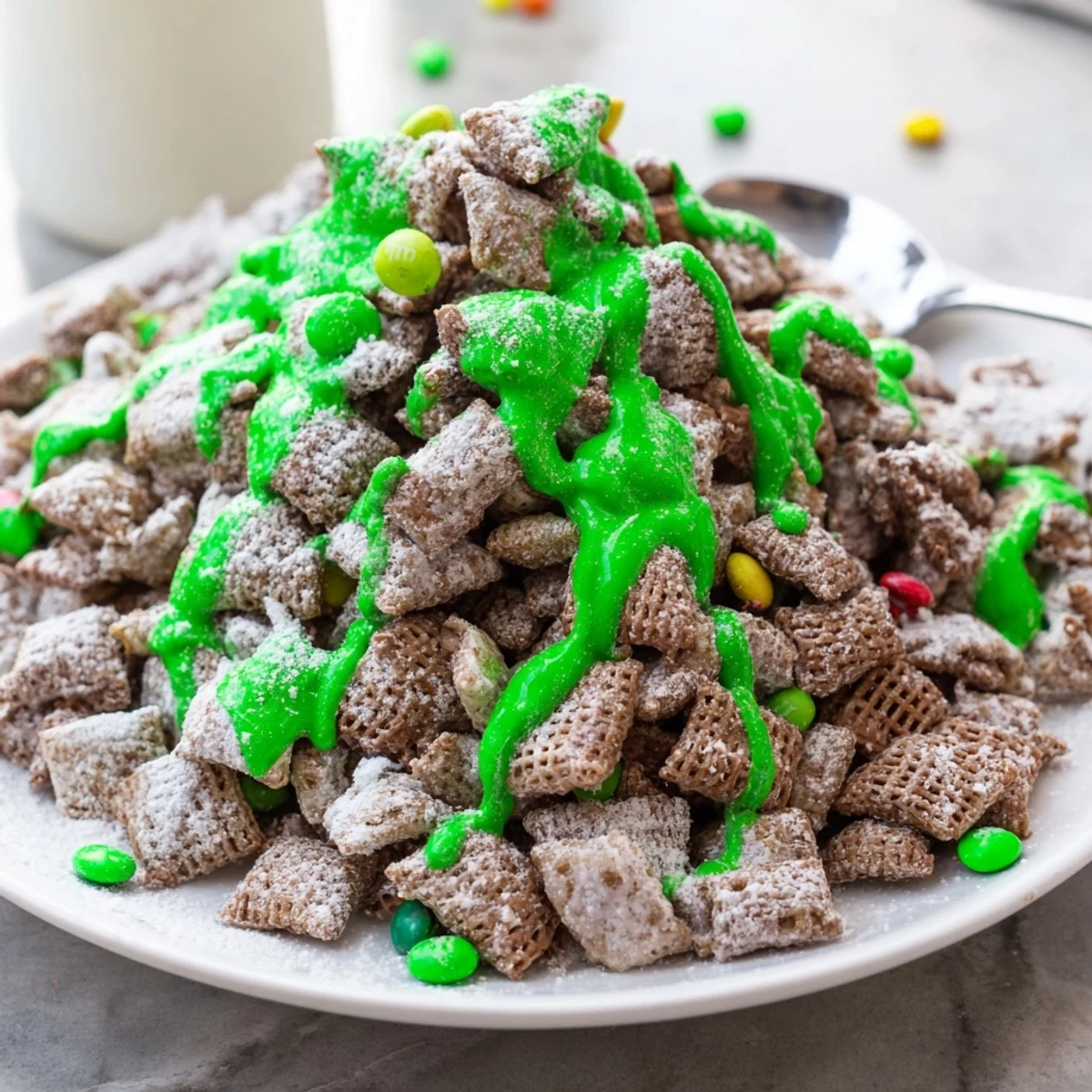 Festive St. Patricks Day puppy chow with chocolate peanut butter coating and green sprinkles