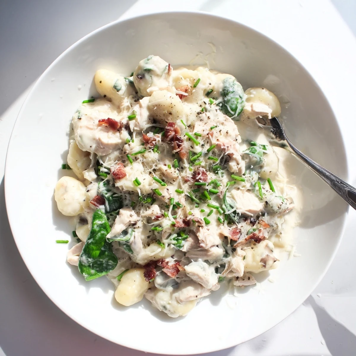Creamy crack chicken gnocchi with crispy bacon and fresh spinach in a rich cheese sauce