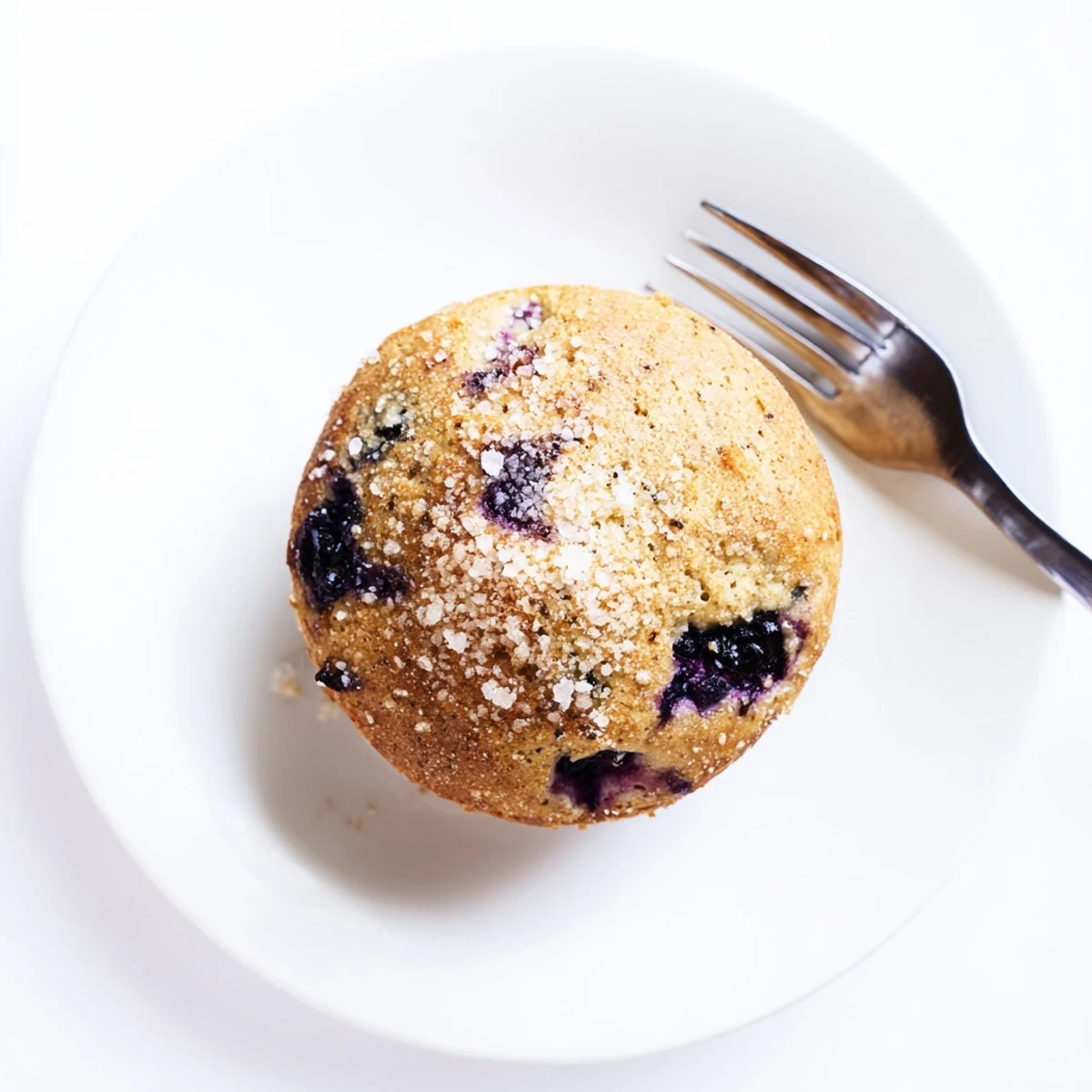 Golden blueberry biscuits fresh from the oven with juicy fruit bursting through tender flaky layers