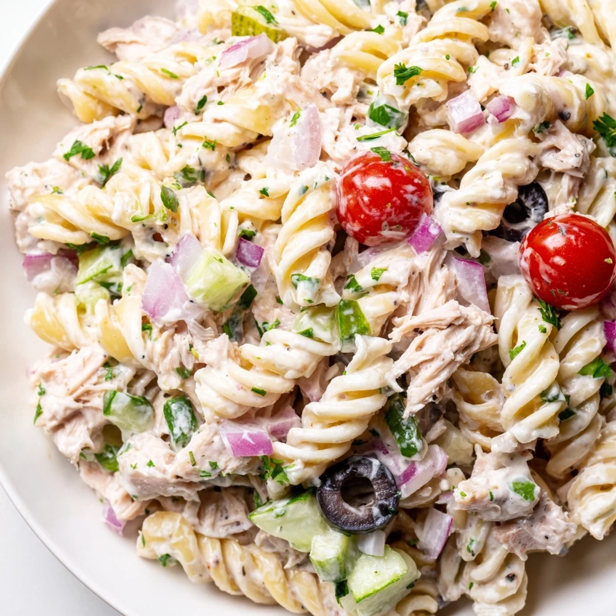 Creamy tuna pasta salad in a bowl with colorful crisp vegetables and tender pasta