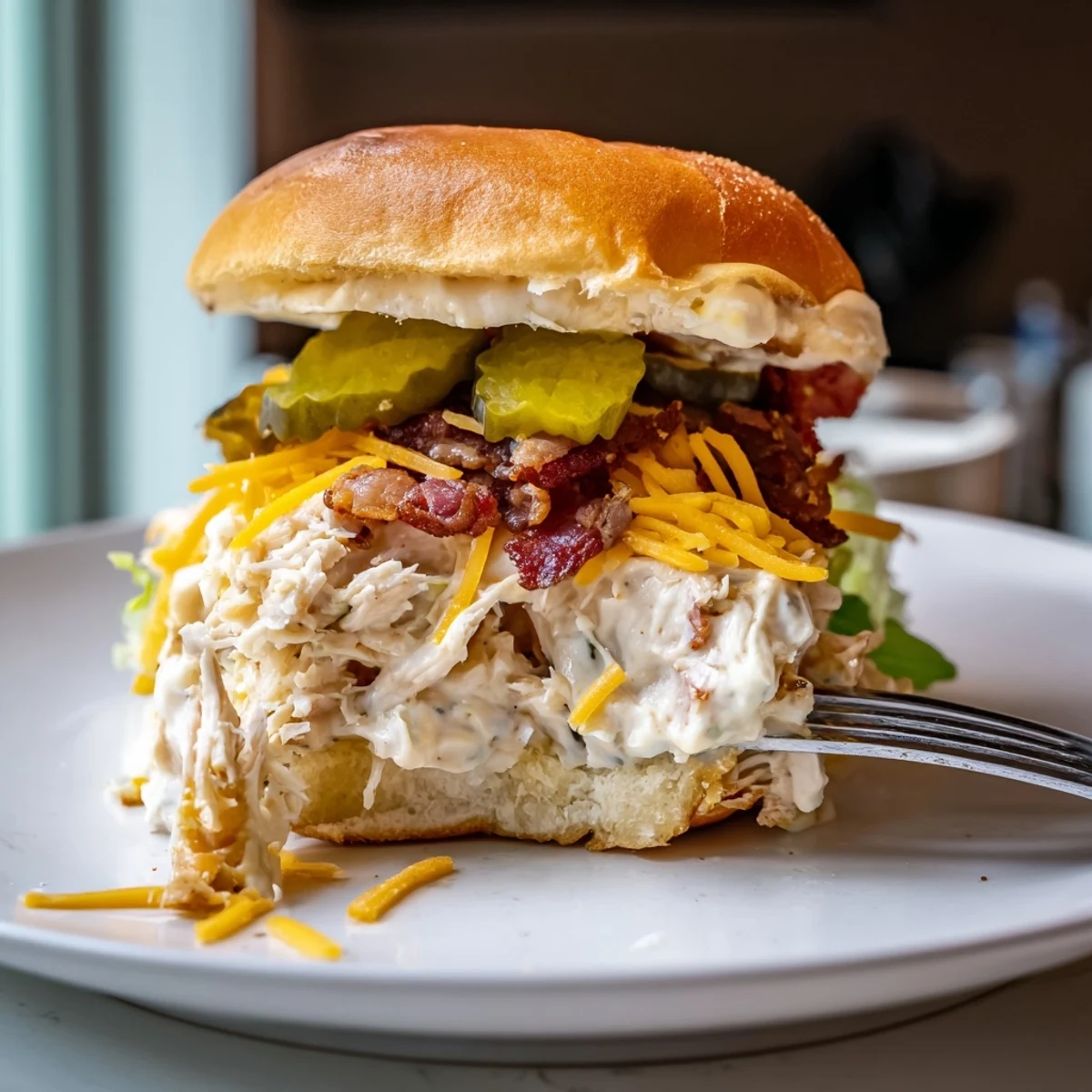 Warm Crack Chicken Sandwiches piled high with bubbly cheddar and crispy bacon
