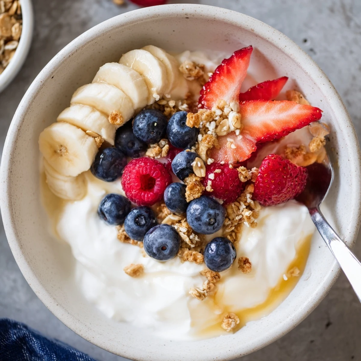 Cottage Cheese Breakfast Bowl topped with creamy curds, ripe berries, honey drizzle  