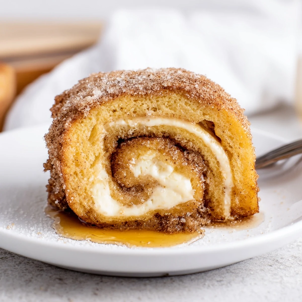 Cinnamon Roll French Toast Roll Ups warm, golden, cinnamon-sugar coated and cream-filled