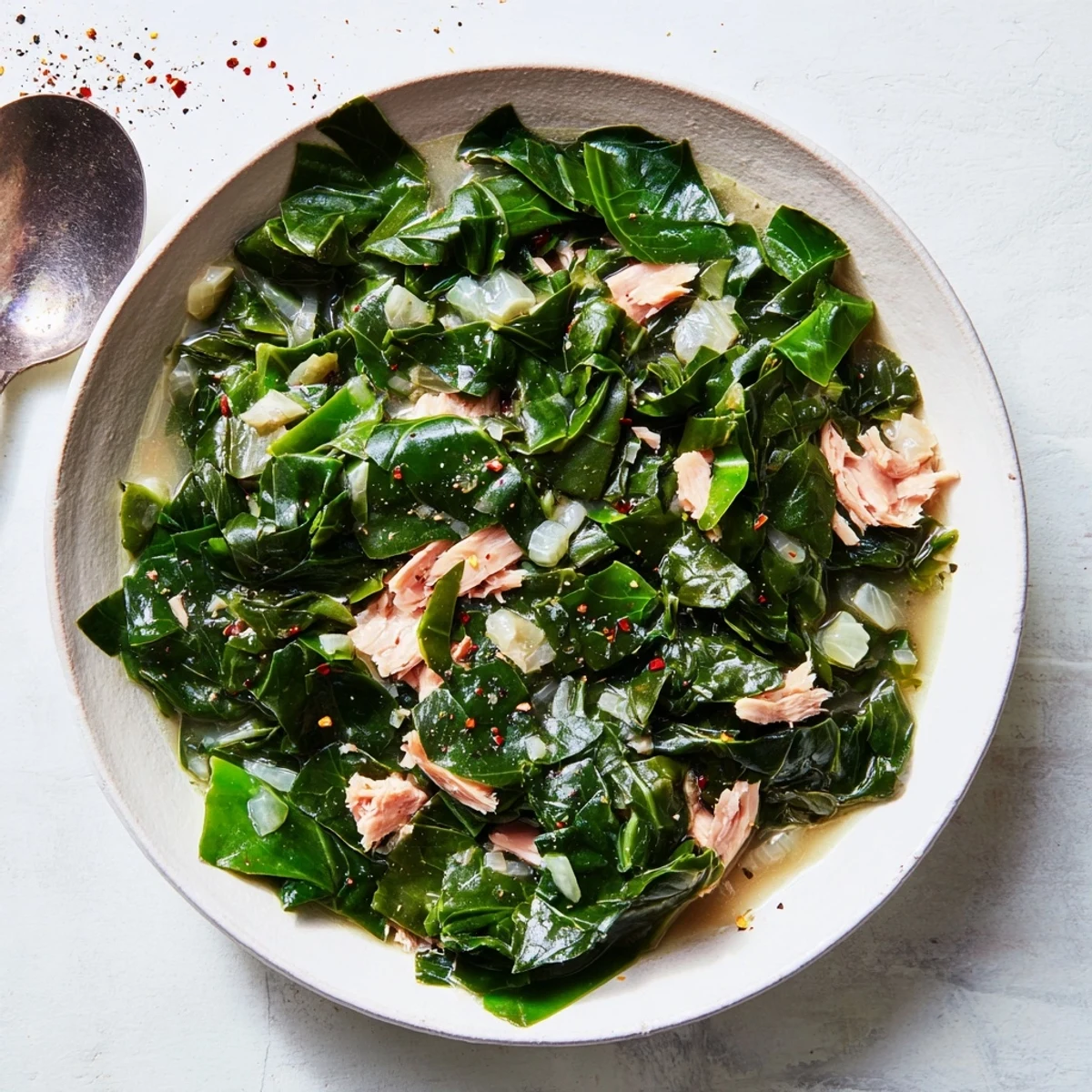 Southern-style collard greens simmered in a flavorful pot with tender smoked meat