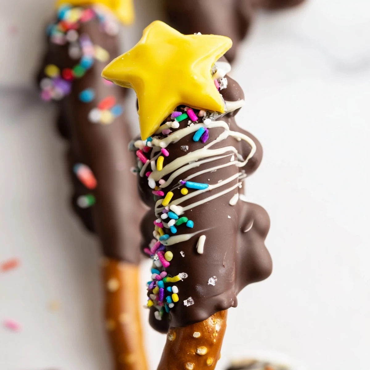 Easy chocolate pretzel trees on parchment paper ready for holiday parties and festive gatherings