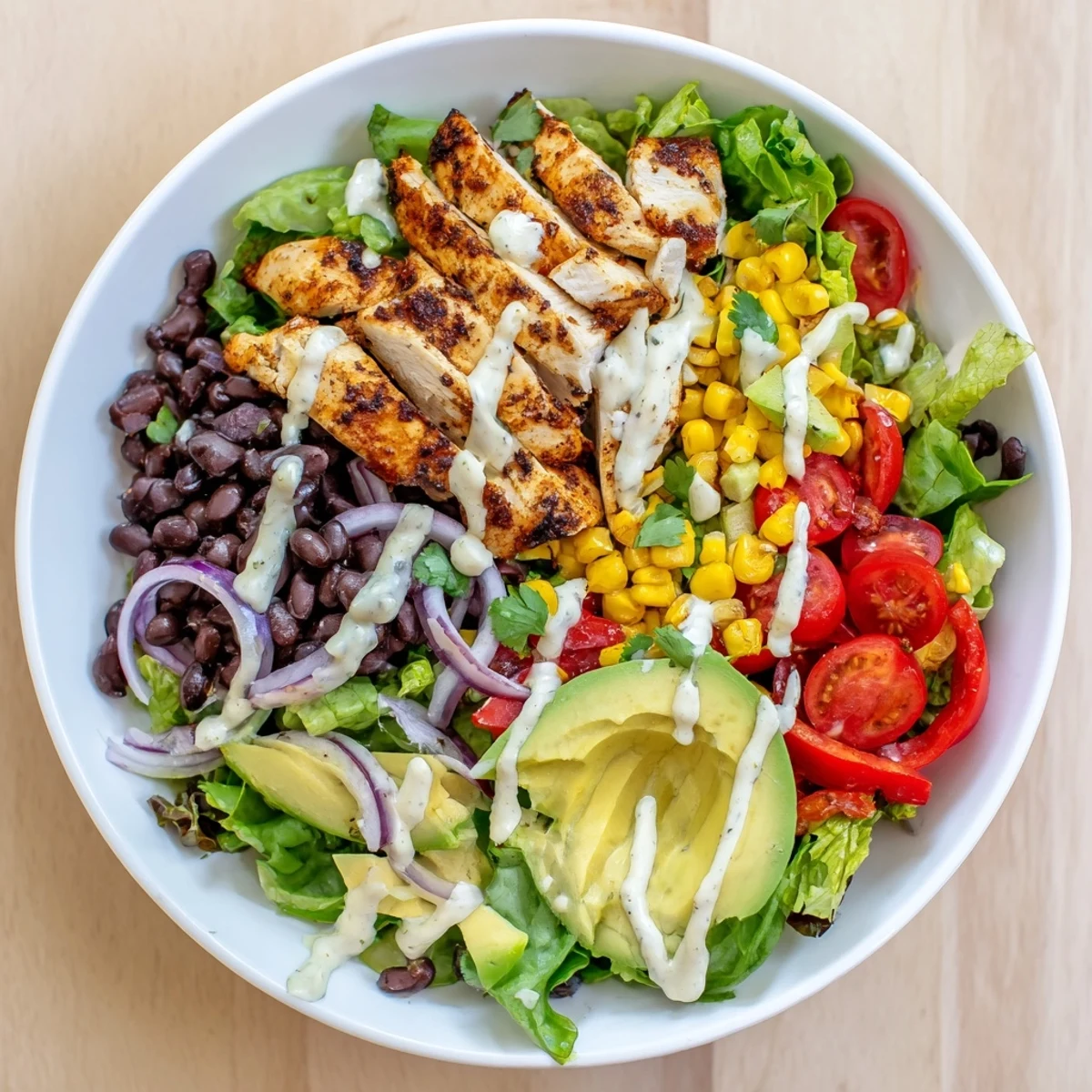 Bright Southwestern Chicken Salad piled with avocado, cherry tomatoes, and cilantro