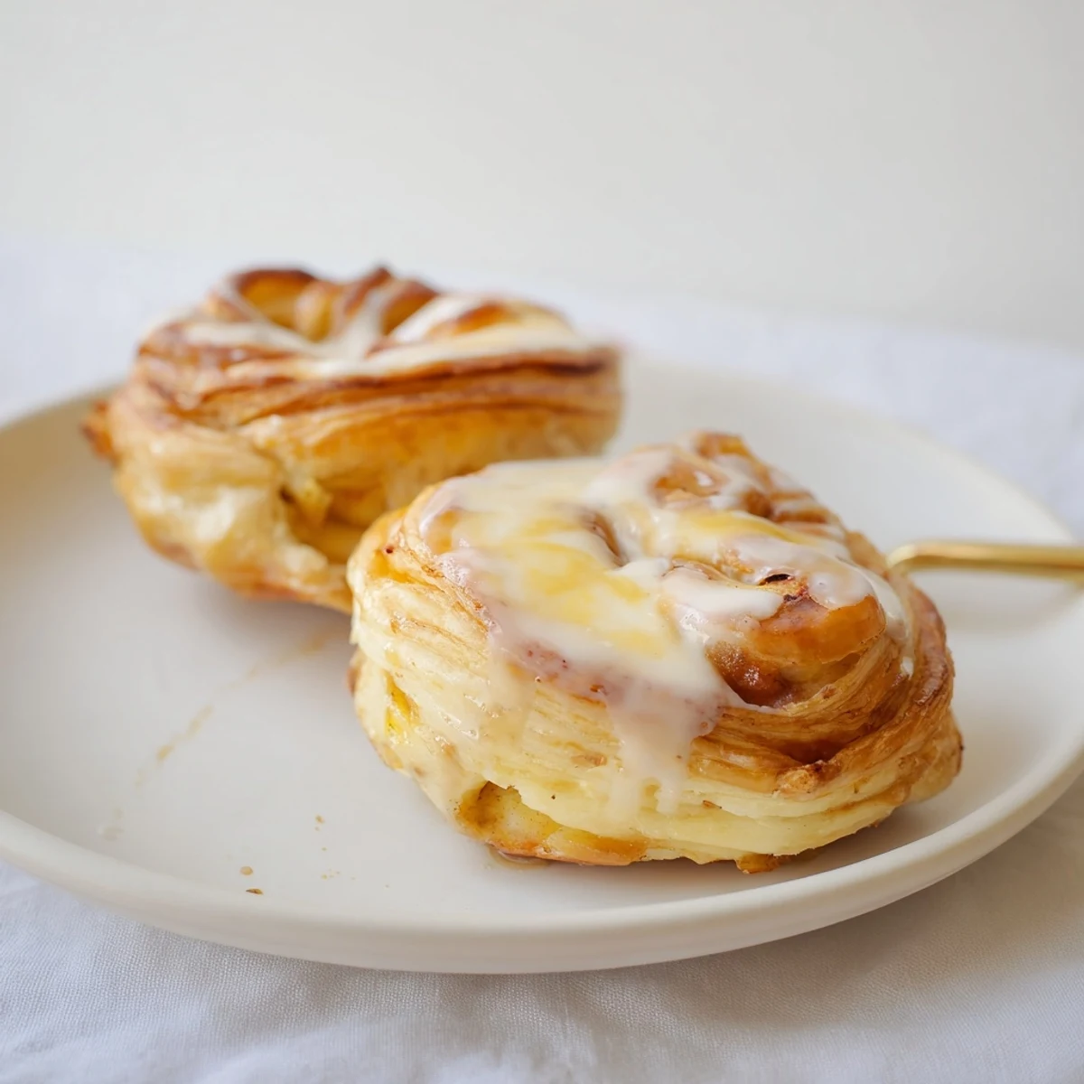 Flaky pastry topped with warm spiced apples and creamy cheese filling  