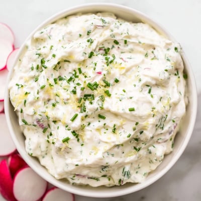 Fresh herb garnish tops the Simple Easter Herb Cheese Dip, a creamy appetizer perfect for Easter gatherings and spring celebrations.